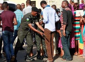 Nigerian Police Searching a Youth